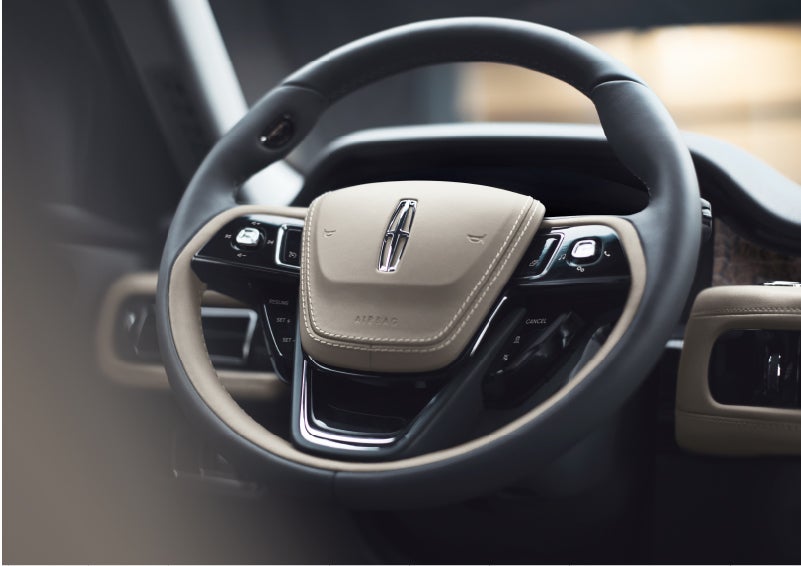 The intuitively placed controls of the steering wheel on a 2023 Lincoln Aviator® SUV | Rogers Lincoln in Midland TX