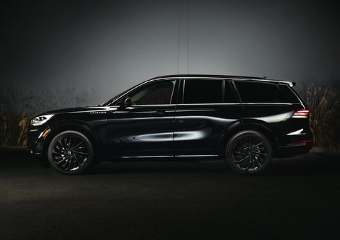 A 2024 Lincoln Aviator® SUV is shown in the Infinite Black exterior color | Rogers Lincoln in Midland TX