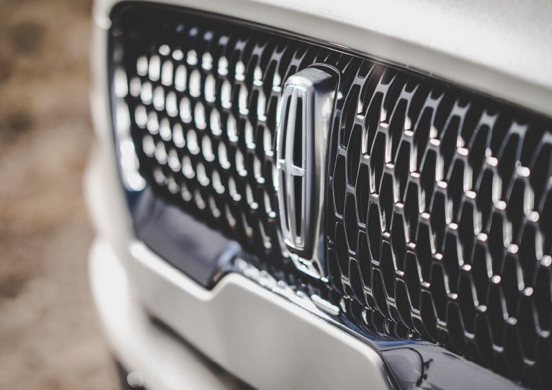 The grille of the 2024 Lincoln Aviator® Reserve model with an eye-catching repeated field of Lincoln Star logo shapes | Rogers Lincoln in Midland TX