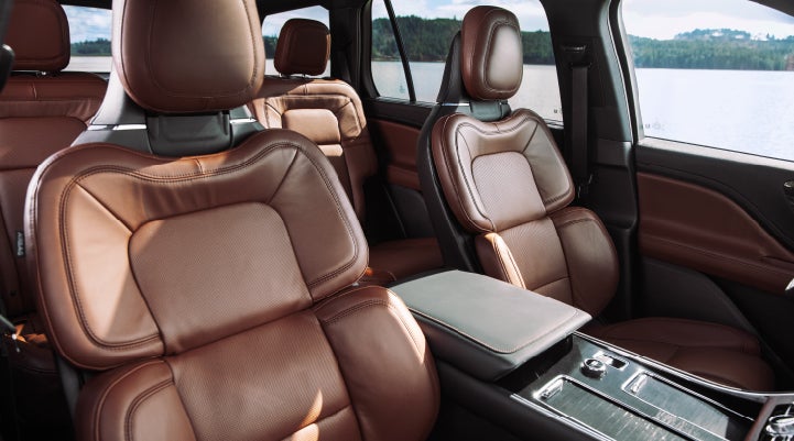 The front row's Perfect Position Seats in a 2024 Lincoln Aviator® Reserve model with Ebony Roast interior | Rogers Lincoln in Midland TX