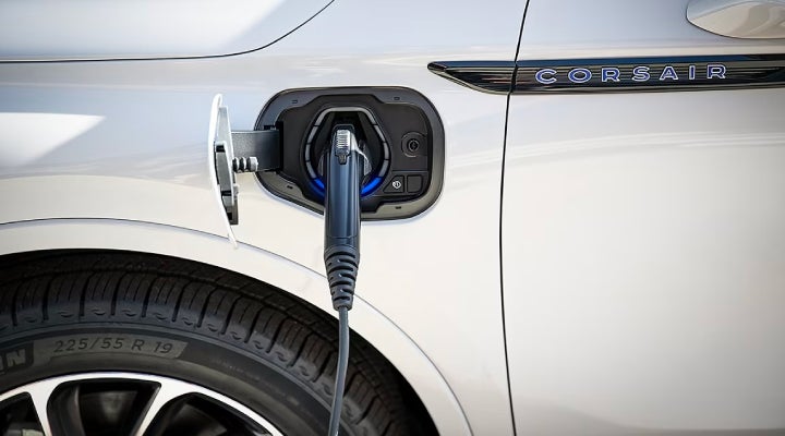 An electric charger is shown plugged into the charging port of a Lincoln Corsair® Grand Touring
model. | Rogers Lincoln in Midland TX