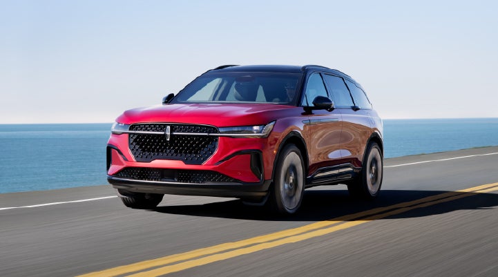 A 2025 Lincoln Nautilus® SUV is being driven on a seaside roadway. | Rogers Lincoln in Midland TX