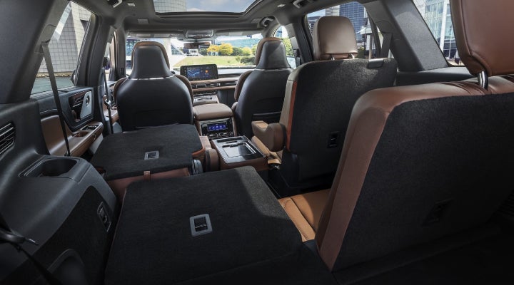 One side of the PowerFold® third-row seat and a second-row seat are folded forward in the 2026 Lincoln Aviator® SUV. | Rogers Lincoln in Midland TX