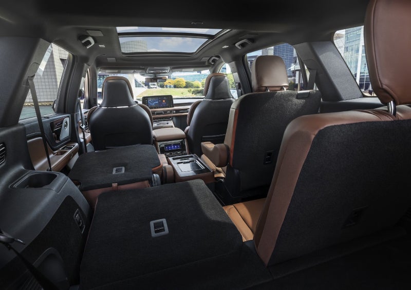 One side of the PowerFold® third-row seat and a second-row seat are folded forward in the 2026 Lincoln Aviator® SUV. | Rogers Lincoln in Midland TX