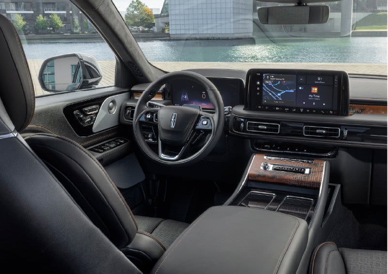 The interior of the 2026 Lincoln Aviator® SUV is shown parked with a view of a harbor through the windshield. | Rogers Lincoln in Midland TX