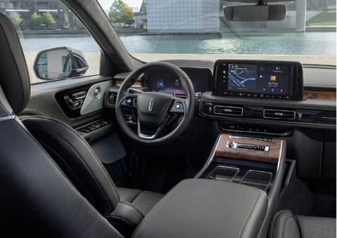 The interior of the 2026 Lincoln Aviator® SUV is shown parked with a view of a harbor through the windshield. | Rogers Lincoln in Midland TX