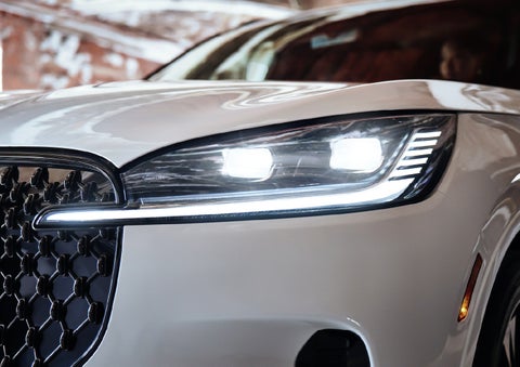 A close-up of a headlamp on the 2027 Lincoln Aviator® SUV is shown. | Rogers Lincoln in Midland TX