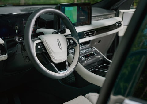 The leather-trimmed steering wheel of a 2027 Lincoln Aviator® Black Label™ SUV. | Rogers Lincoln in Midland TX