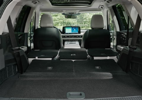 A rear to front view of the interior of a 2027 Lincoln Aviator® Black Label™ SUV shows the third and second rows folded flat | Rogers Lincoln in Midland TX